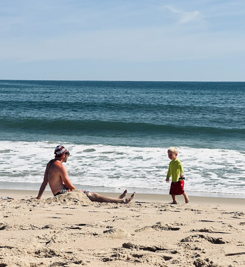 Dad and son on the beach in Kill Devil Hills, NC