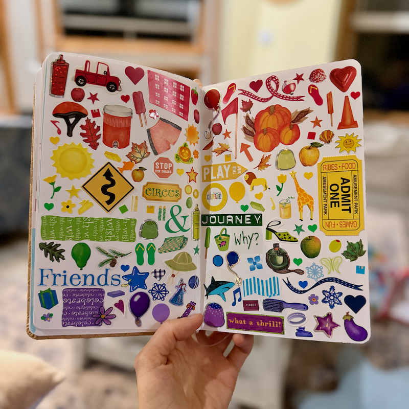 Junk journal of stickers in a rainbow
