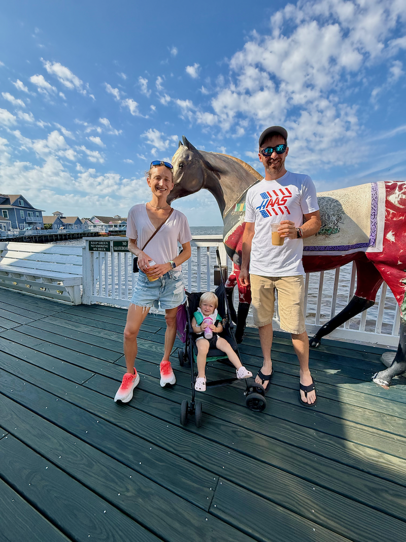 Parents with toddler on Duck boardwalk in Outer Banks, NC