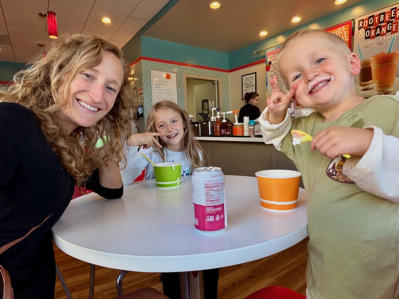 Mom and kids at frozen yogurt shop