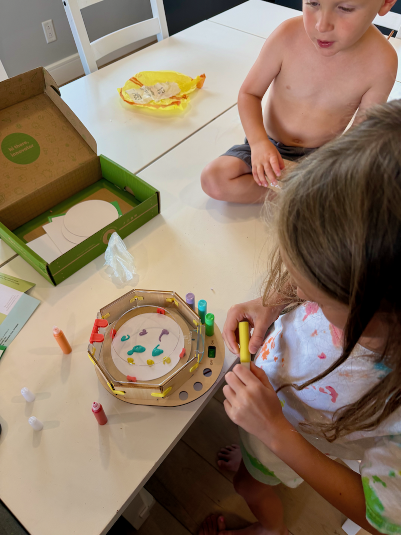 Kids doing Kiwi Co. spin art