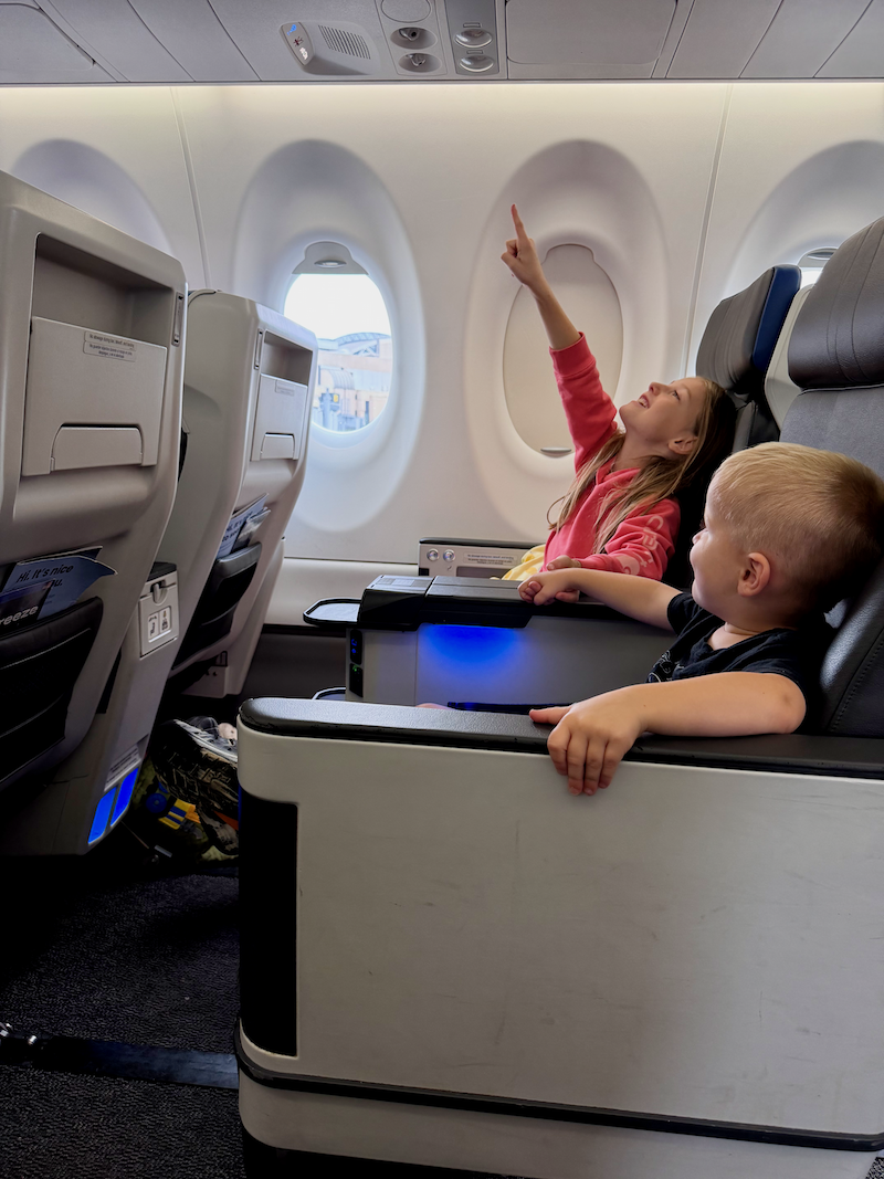 Kids sitting together on plane