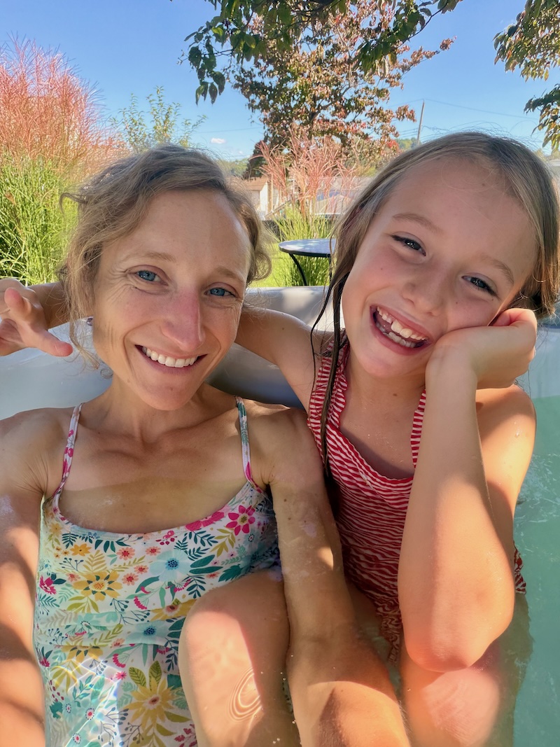 Mom and daughter in hot tub