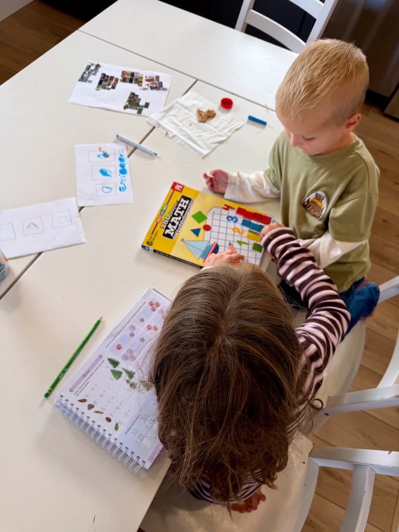 Kids doing school at the kitchen table